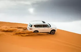 Dubai Desert Safari Dune Bashing, Camel Ride, Sand Boarding, BBQ Dinner.